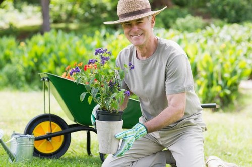 Pruning shrubs in a well-maintained garden
